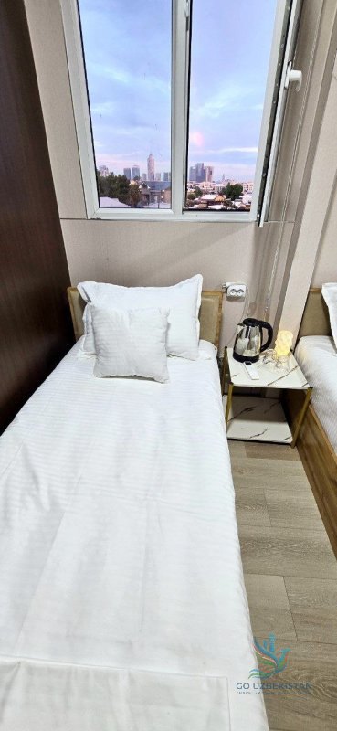 Quad room with a private bathroom, air conditioning, and Wi-Fi — photo 2